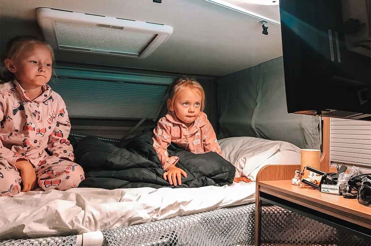 https://www.wilderness.co.nz/hs-fs/hubfs/Images/Blog/Travelling%20with%20Kids%20in%20a%20Motorhome/Kids%20watching%20a%20movie%20in%20motorhome%20dropdown%20bed.jpg?height=795&name=Kids+watching+a+movie+in+motorhome+dropdown+bed.jpg&width=1200
